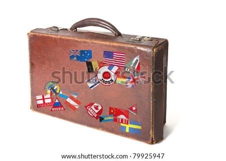 old vintage style suitcase with lots of stickers and flags from around the world on a white background