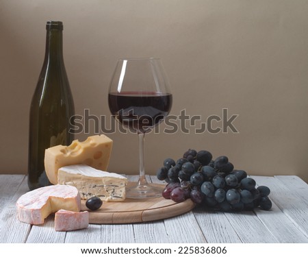 Wine and fresh cheese on the table