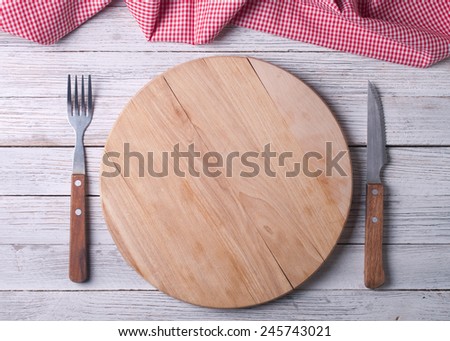 Empty tray on tablecloth on wooden table