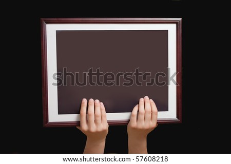 Simple wooden Frame in hands