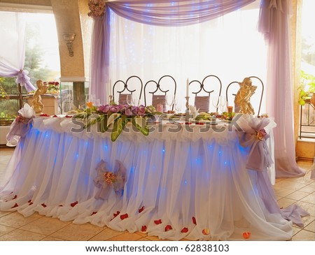 stock photo Table set for a wedding dinner decorated with flowers and a