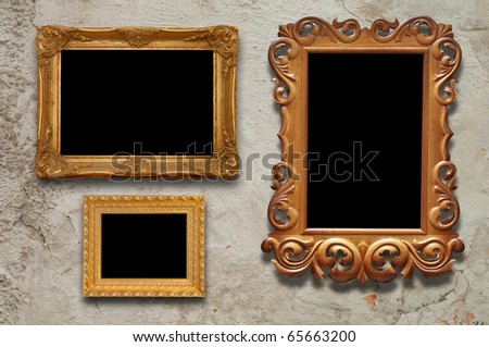 old frames on the wall in the interior grunge