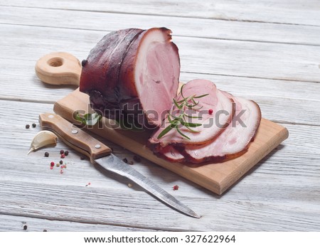 smoked ham on wooden background