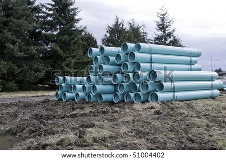 Bundles of blue PVC pipe ready for the sewer or water line.