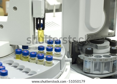 a vial grabbed by autosampler of gas chromatography