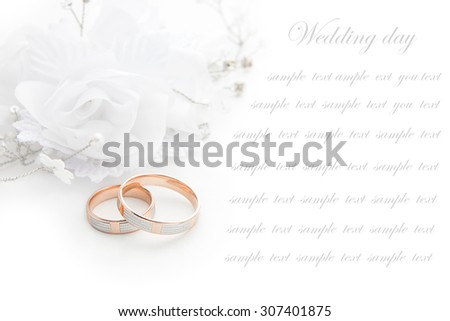 Wedding rings on wedding card  on a white background