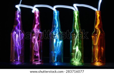 Colored bottles with small light moving inside the bottles.
