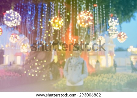 Blurred background : woman in front of the tree light at south korea