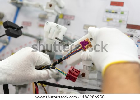 Process of manufacturing the wiring harnesses for vehicles, automobile industry