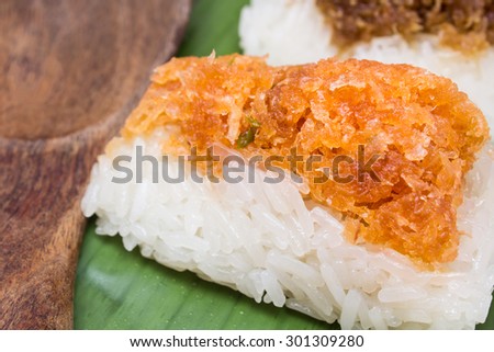 Thai style sweet dessert. Shrimp and shred coconut on sticky rice. on banana leaf wrap and served small piece like Sushi style
