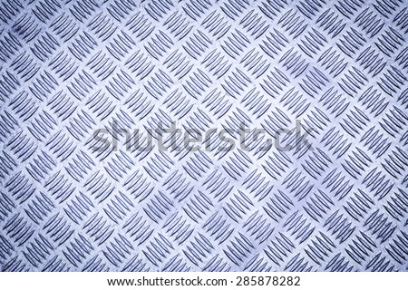 Blue colored Diamond plate also known as checker plate, tread plate, cross hatch kick plate and Durbar floor plate, wide shot in landscape orientation.