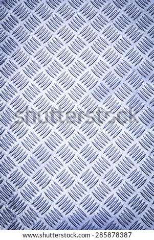 Blue colored Diamond plate also known as checker plate, tread plate, cross hatch kick plate and Durbar floor plate, wide shot in portrait orientation