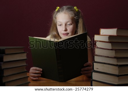 Girl is reading big book