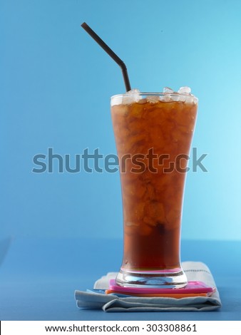 ice black tea on blue background