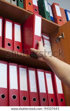hand reaching down to the binder