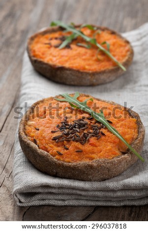 Vegetable cake on tablecloth on wooden table