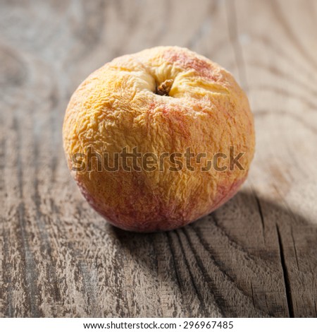 Old fruit on wooden table