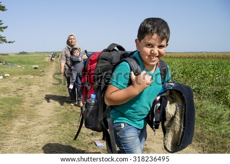 SID, SERBIA - SEPTEMBER 19, 2015: Refugees are crossing the Serbo-Croatian border between the cities of Sid (Serbia) and Tovarnik (Croatia).