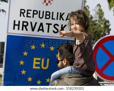 SID, SERBIA - SEPTEMBER 19, 2015: Refugees are crossing the Serbo-Croatian border between the cities of Sid (Serbia) and Tovarnik (Croatia)