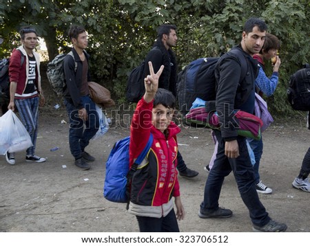 SID, SERBIA - OCTOBER 3, 2015: Refugees entering Croatia between the cities of Sid (Serbia) and Bapska (Croatia).