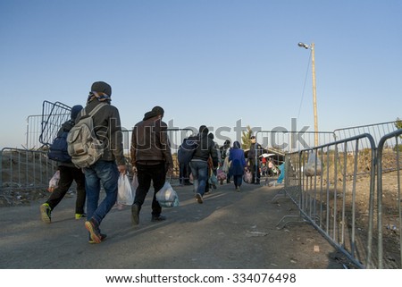 SID, SERBIA - OCTOBER 31, 2015: Refugees crossing the Serbo-Croatian border between the cities of Sid (Serbia) and Bapska (Croatia).