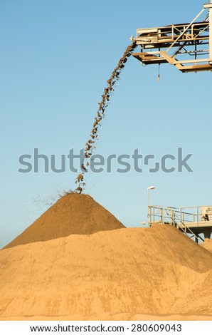 Sand falling from a conveyor belt