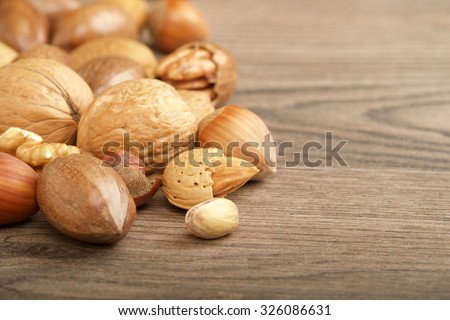 mixed nuts on wooden background