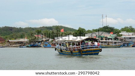HA LONG CITY, VIETNAM - JUN 23, 2015. Tourist boats near the port of the Ha Long city where many touristic boats start jorneys over the Ha Long bay which is UNESCO World heritage.