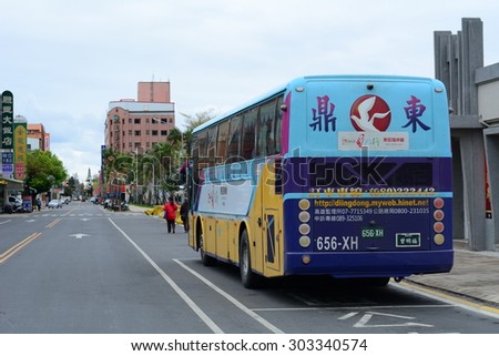 CHONGQING, CHINA - NOV 4, 2014: A public bus on the street in Chongqing, China. Start price is CNY 1 for common buses and CNY 1.5 for air-conditioned buses. Running hour buses is 5:30 to 21:00.