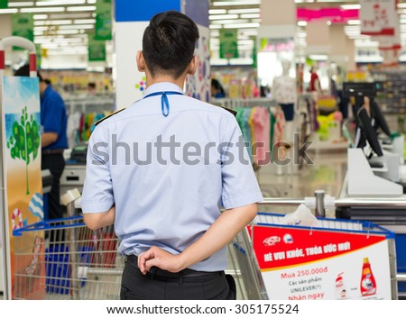 Saigon, Vietnam - Aug 1, 2015. A shop assistant seller at Coopmart supermarket in Saigon, Vietnam.