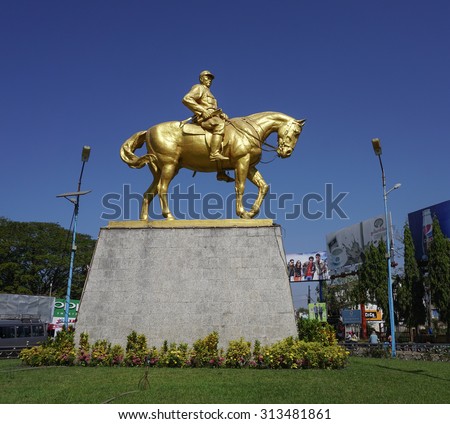 YANGON, MYANMAR - JAN 14, 2015. Monument of General Aung San with his horse in Yangon, Myanmar. He\'s considered Father of the Nation of modern-day Myanmar.