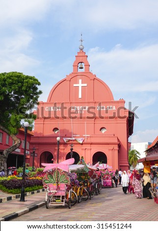 MALACCA, MALAYSIA - AUG 7, 2015. Day view of Christ Church & Dutch Square in Malacca City, Malaysia. It was built in 1753 by Dutch & is the oldest 18th century Protestant church in Malaysia.