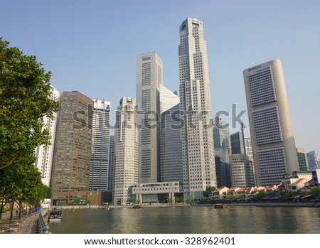 Singapore - Jul 22, 2015. Tall and modern skyscrapers built in business district of Singapore. Singapore's total trade in 2014 amounted to S$982 billion.