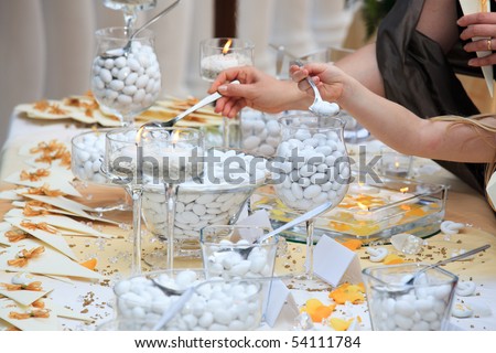 stock photo Kids choosing candies from wedding buffet
