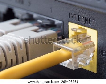 Network cables connected to a router or modem