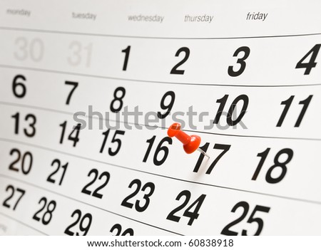 Closeup calendar page with drawing-pin