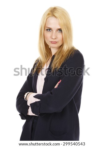 An attractive businesswoman wearing a jacket smiles and looks at the viewer with her arms crossed.