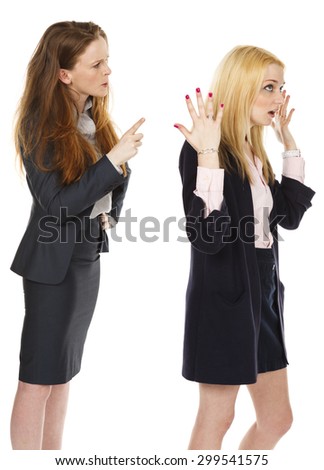 One woman waves her finger at the other, while the other turns away and throws her hands up in frustration.