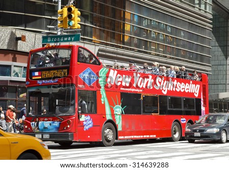 New York, New York, USA - May 1, 2011: A red Gray Line double decker tour bus making its way through times square near 43rd street in New York City.