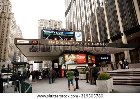 New York, New York, USA - March 14, 2011: People walking by the entrance to Madison Square Garden and Penn Station on Seventh Avenue in Manhattan in the afternoon.