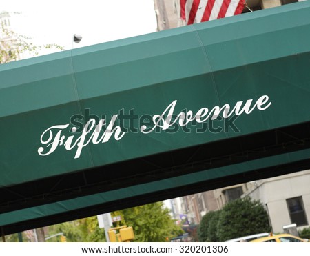 An awning with the words Fifth Avenue.