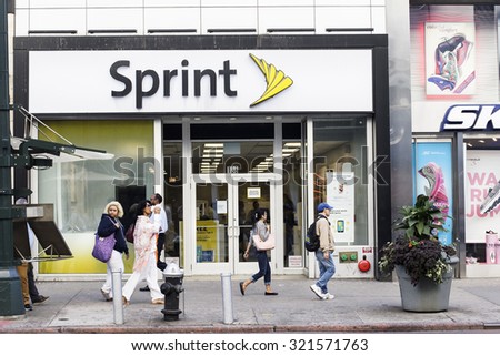 New York, New York, USA - September 23, 2015: People walking by Sprint store on 34th Street in Manhattan. Sprint is a wireless provider.