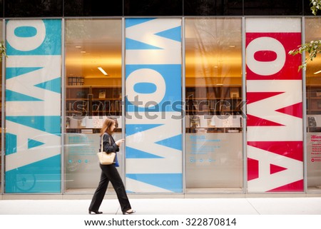 New York, New York, USA - September 13, 2011: A woman walking in front of the Museum of Modern Art Design and Book Store on West 53rd Street in Manhattan.