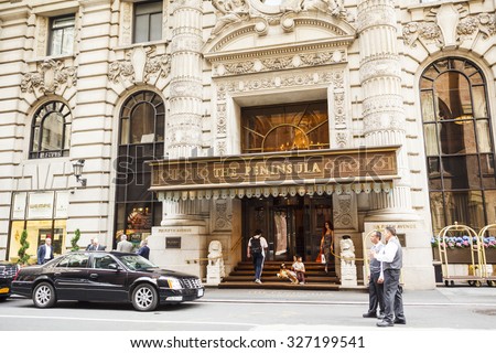 New York, New York, USA - May 30, 2012: The Peninsula Hotel is a well known luxury hotel in Midtown Manhattan. People can be seen on the street as well as on the steps of the entrance.