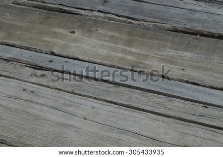 Old wooden floor damaged by time and insects