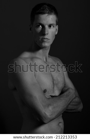 Young male model posing with a bare chest