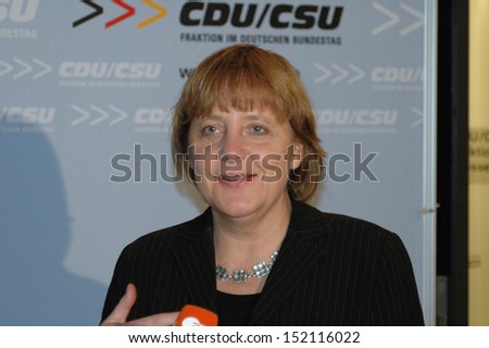 NOVEMBER 9, 2004 - BERLIN: Chairwoman of the Christian Democratic Party (CDU), Angela Merkel talks to members of the press before a meeting of the party faction in the German Bundestag.