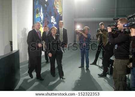 DECEMBER 19, 2007 - BERLIN: Roland Koch, Chancellor Angela Merkel, media after a press conference in the Chanclery in Berlin.