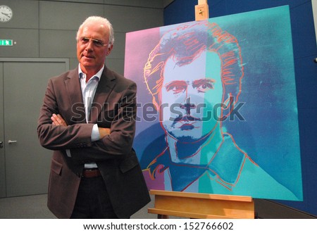 SEPTEMBER 1, 2005 - BERLIN: German soccer legend Franz Beckenbauer next to his portrait painting (by Andy Warhol) - presentation of the cultural program to the soccer world championship, Berlin.