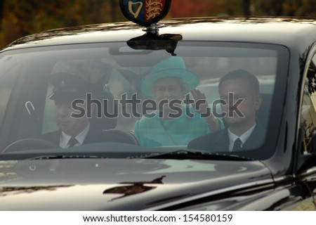 BERLIN-NOVEMBER 2, 2004: Queen Elizabeth II (Elizabeth Alexandra Mary Windsor) in her car during a state visit in Germany.